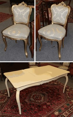 Lot 1387 - A French style painted extending dining table with additional leaf, raised on scroll supports, 90cm