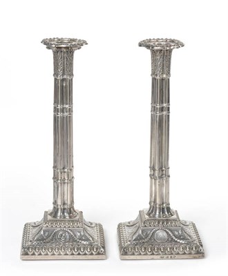 Lot 320 - A Pair of George III Candlesticks, maker's mark IM, London 1772, one nozzle E Coker, the square...