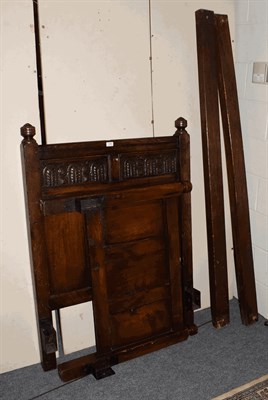 Lot 1396 - An 18th century style carved oak single bedstead, 93cm wide by 120cm high