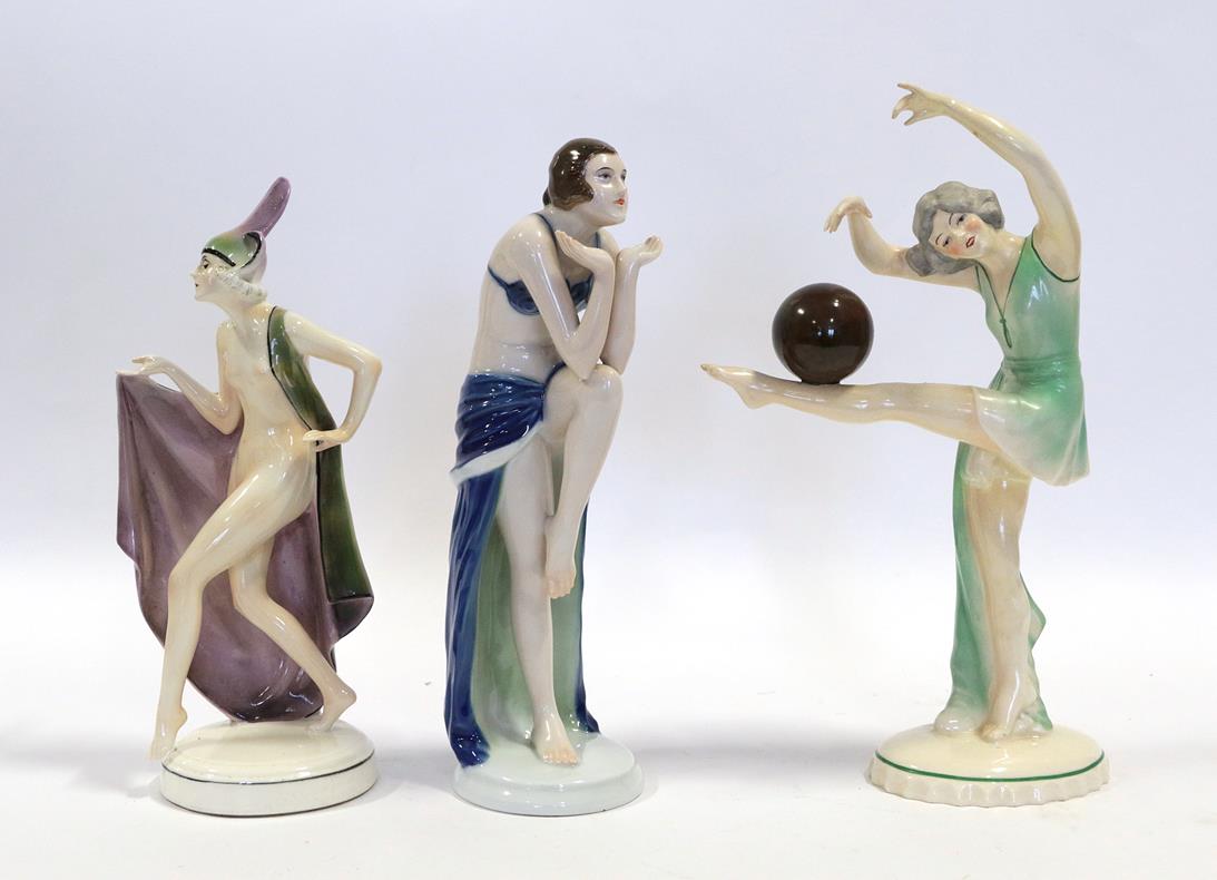 Lot 2038 - An Art Deco Katzhutte (Thuringia) Pottery Figure, modelled as a nude female wearing a cape and...