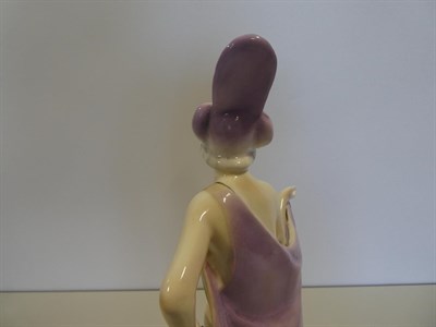Lot 2038 - An Art Deco Katzhutte (Thuringia) Pottery Figure, modelled as a nude female wearing a cape and...