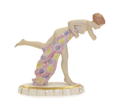 Lot 2039 - An Art Deco Royal Dux Figure, modelled as a nude young woman in a running pose, clasping a pink...