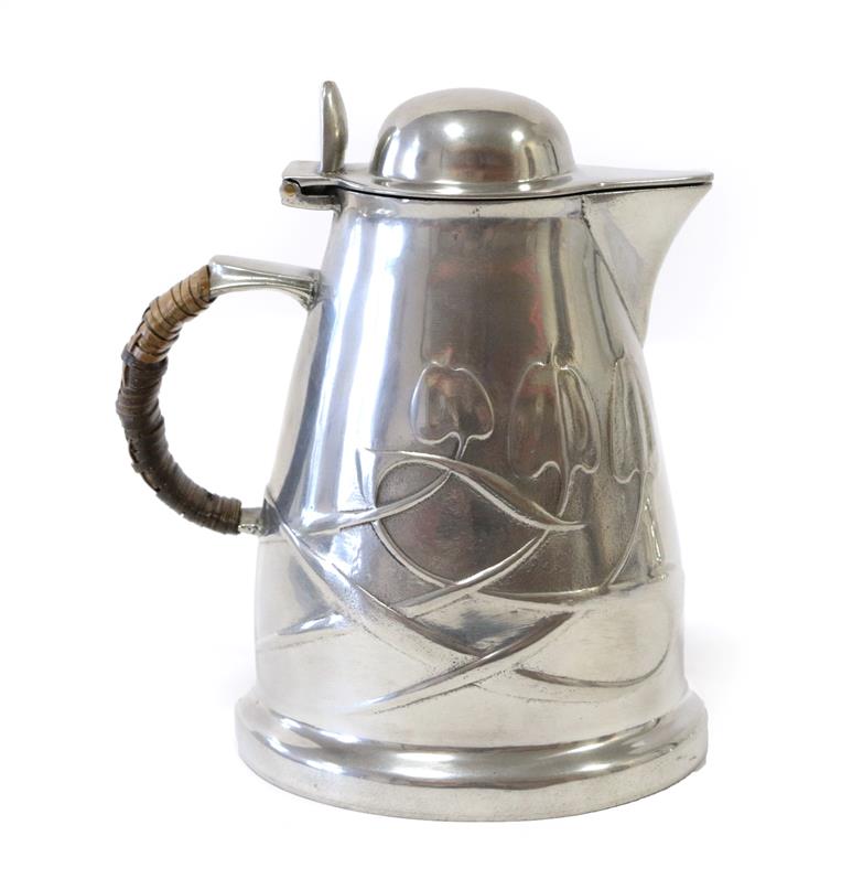 Lot 2063 - Liberty & Co: A Tudric Pewter Hot Water Jug, with a domed hinged cover, rattan covered handle, with