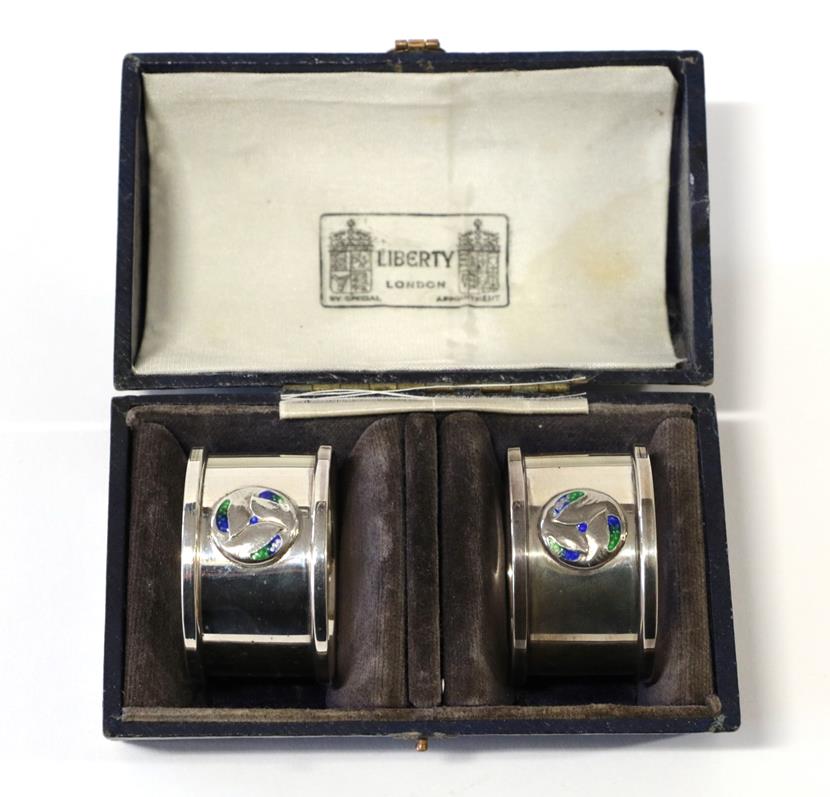 Lot 2068 - A Pair of Arts & Crafts Silver and Enamel Napkin Rings, made by William Hair Haseler, with stylised