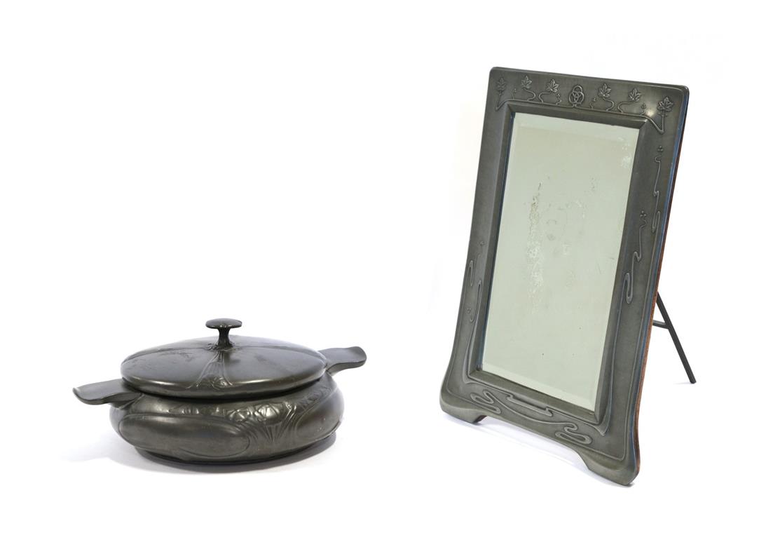 Lot 2075 - An Art Nouveau Pewter Easel Toilet Mirror, the top with three interlinking circles surrounded...