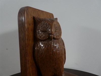Lot 2086 - Robert Mouseman Thompson (1876-1955): An English Oak Table Brush Holder, carved as an owl holding a