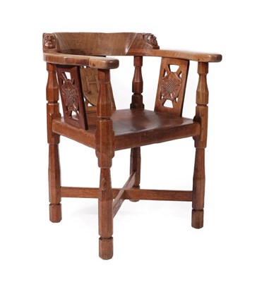 Lot 2087 - Robert Mouseman Thompson (1876-1955): An English Oak Monk's Chair, with curved back and shaped...