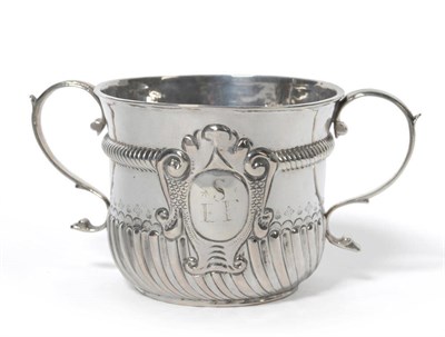 Lot 337 - A William III Porringer, James Chadwick, London 1697, the part spirally loaded body with...