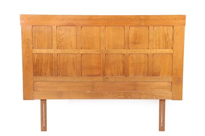 Lot 2182 - Cat and Mouseman: Lyndon Hammell (Harmby): An English Oak Panelled Divan Headboard, recessed carved