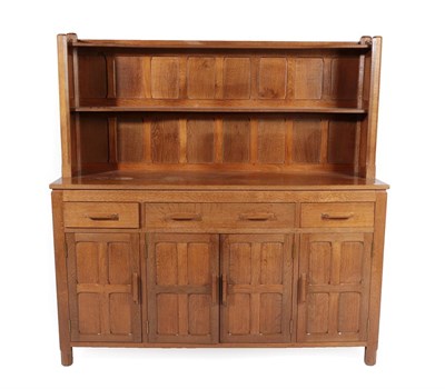 Lot 2197 - A Sid Pollard of Thirsk English Oak 5ft Panelled Dresser, the upper section with two shelves,...