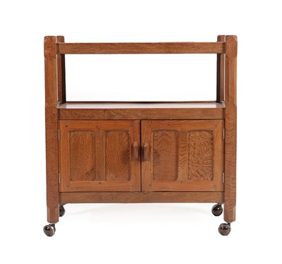 Lot 2200 - A Sid Pollard of Thirsk English Oak Tea Trolley, the two tiers above two panelled cupboard...