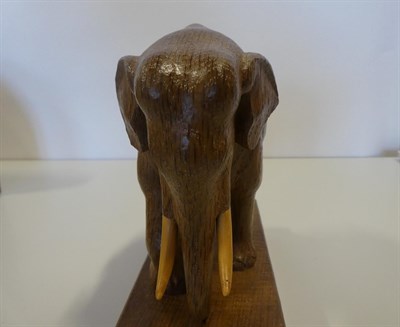 Lot 2205 - Woodpeckerman: Stan Dodds (1928-2012): An English Oak Elephant Carving, with right front leg...