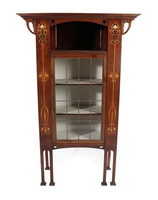 Lot 2218 - An Art Nouveau Leaded Glazed and Marquetry Inlaid Mahogany Display Cabinet, with an overhanging...