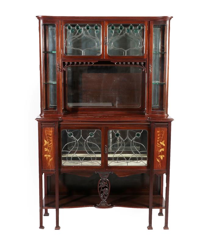 Lot 2219 - An Art Nouveau Leaded Glazed Mahogany Inlaid Display Cabinet, the upper section with two doors...