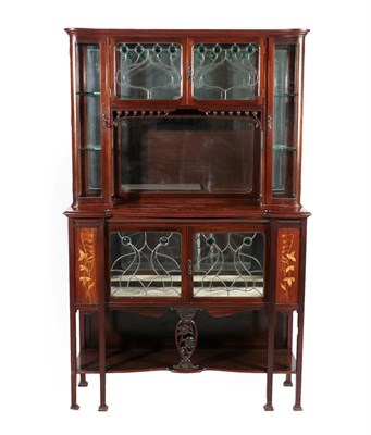 Lot 2219 - An Art Nouveau Leaded Glazed Mahogany Inlaid Display Cabinet, the upper section with two doors...