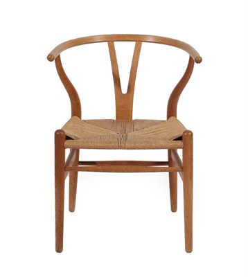 Lot 2229 - Hans Wegner (Danish, 1914-2007) for Carl Hansen: A 1970's CH24 Wishbone Chair, weaved cord...