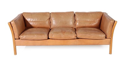 Lot 2236 - A 1970's Danish Tan Leather Three Seater Sofa, on an ash and canvas frame, 222cm wide, 85cm...