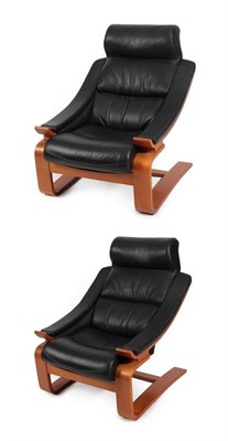 Lot 2242 - A Pair of Swedish Nelo Cantilever Lounge Chairs, designed by Ake Fribytter, black leather and...