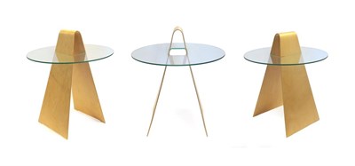 Lot 2243 - A Set of Three Birch Plywood and Glass Side Tables, possibly designed by Hans Peter Weidmann...