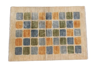 Lot 2263 - A 20th Century Wool Rug, with green, blue and orange rectangles on an oatmeal ground, labelled...