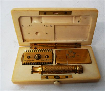 Lot 352 - A Gillette "Aristocrat" Gilt Metal Razor Set, 20th century, in a hinged fitted ivory case...