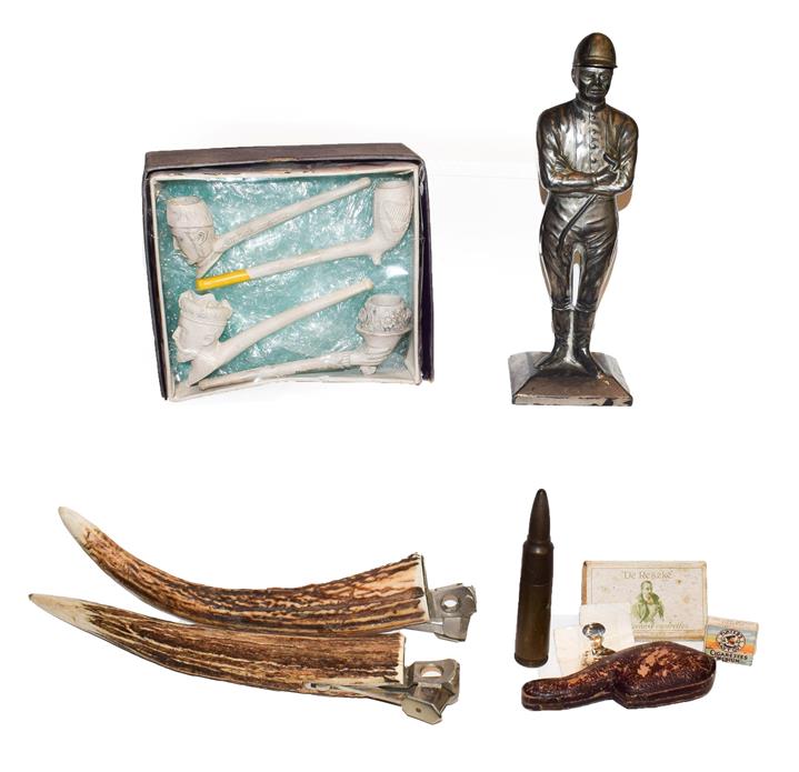 Lot 32 - A tray of smoking related collectables including a pair of antler cigar cutters, table lighter...