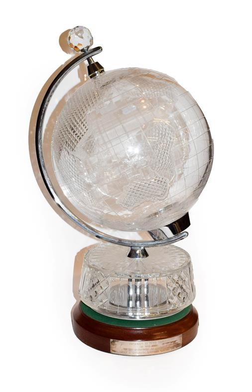 Lot 34 - A Waterford cut glass table globe on an oak base bearing presentation plaque, 59cm high