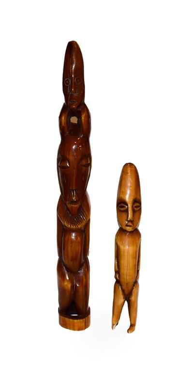 Lot 35 - Two African vegetable ivory figures, Luba style, largest 34cm high (2)