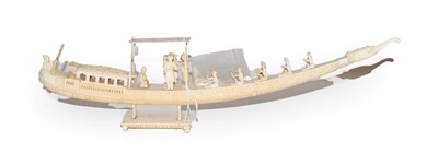 Lot 56 - A 19th century Indian carved ivory model of a boat with figures, 45cm long