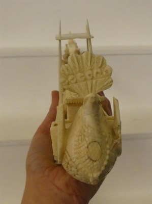 Lot 56 - A 19th century Indian carved ivory model of a boat with figures, 45cm long