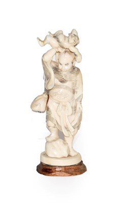 Lot 58 - Japanese Meiji Period carved ivory okimono of two figures, 16cm high