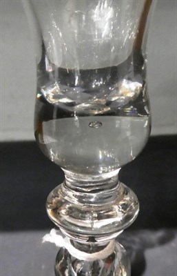 Lot 66 - A baluster wine glass, circa 1740, the bell shaped bowl on an annular knop and baluster stem...