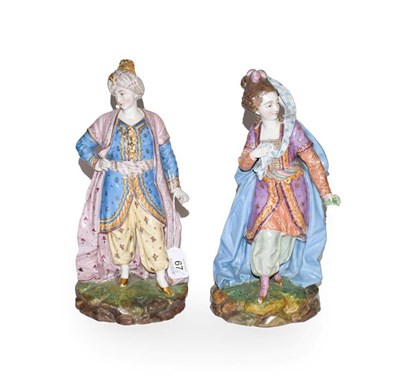 Lot 67 - Pair of 19th century French porcelain figures of Turks, decorated in coloured enamels, 29cm high