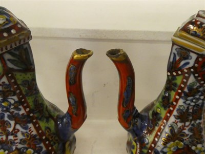 Lot 69 - A pair of 18th century Chinese wine ewers with covers and similar hexagonal jar and cover,...