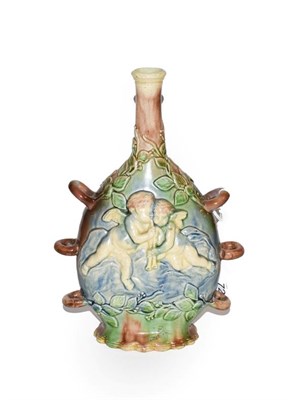 Lot 72 - A majolica pottery flask, decorated in relief with cherubs and leaves, 24.5cm