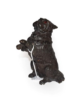 Lot 77 - A bronze figure of a dog, late 19th/early 20th century, naturalistically modelled begging, with red