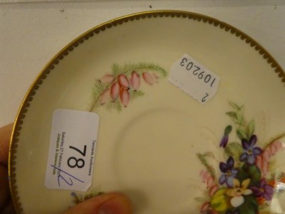 Lot 78 - A Royal Worcester cup and saucer with butterfly moulded handle and painted with flowers, green...