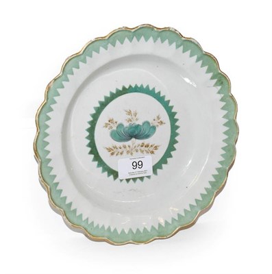 Lot 99 - An 18th century Worcester lobed plate, decorated with gilt and French green enamel with a saw tooth