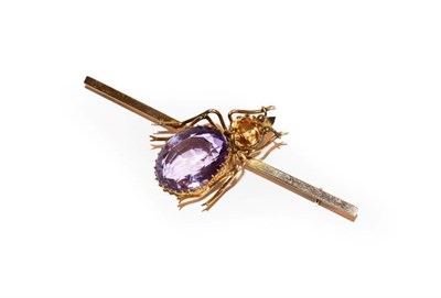 Lot 111 - An amethyst and citrine bug brooch, the bug realistically modelled with an oval cut amethyst...