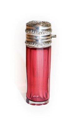 Lot 115 - A Victorian faceted cranberry glass scent bottle with silver top and glass stopper, Birmingham,...