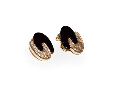Lot 120 - A pair of 18 carat gold diamond and onyx earrings, formed of two interlocking 'C' motifs, one...
