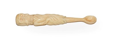 Lot 122 - A Victorian carved ivory apothecary spoon formed as a skeleton dressed in a rob, the skull threaded