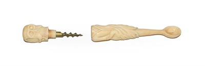 Lot 122 - A Victorian carved ivory apothecary spoon formed as a skeleton dressed in a rob, the skull threaded
