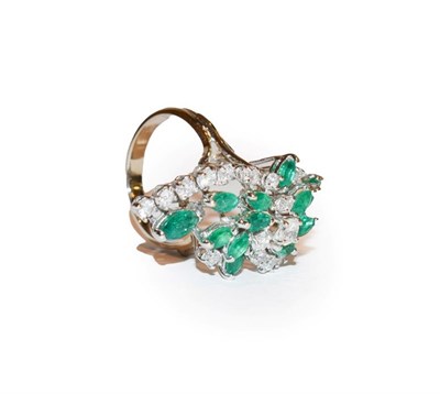 Lot 130 - An emerald and diamond ring, the abstract spray set throughout with round brilliant cut...