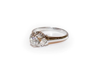 Lot 132 - A diamond solitaire ring, the round brilliant cut diamond in a white claw setting, to a tapered...
