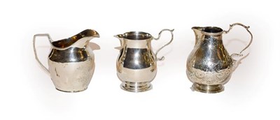 Lot 142 - Two Victorian silver cream-jugs and a George V silver cream-jug, one by Susanna Cook, London, 1851