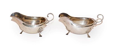 Lot 148 - A pair of George V silver sauceboats, by George Howson, Sheffield, 1917, each oval and on three...