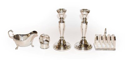 Lot 154 - A collection of silver, each piece with Celtic decoration, comprising a pair of candlesticks,...