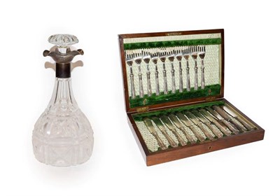 Lot 156 - A George V silver mounted cut glass decanter with three pouring spouts, by Manoah Rhodes and...