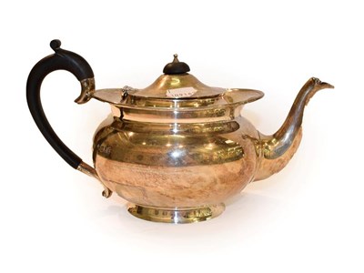 Lot 164 - A George V silver teapot by Henry Wilkinson and Co, London, 1917, with hardwood handles and...